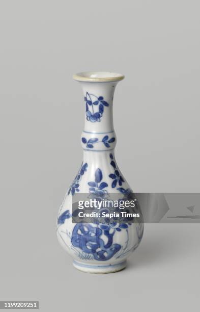 Pear-shaped bottle vase with flowering plants, birds and insects near a rock, Porcelain bottle-shaped vase with a ribbed, pear-shaped body, annular...