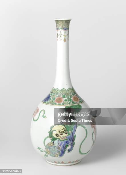 Pear-shaped bottle vase with four shishi and floral scrolls, Porcelain bottle-shaped vase with a pear-shaped body and long, slightly spreading neck,...