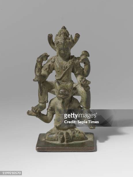 Shiva and Ganesha Siwa sitting on the shoulders of his mount, Bronze sculpture depicting Siwa sitting on the shoulders of his mount, the bull,...
