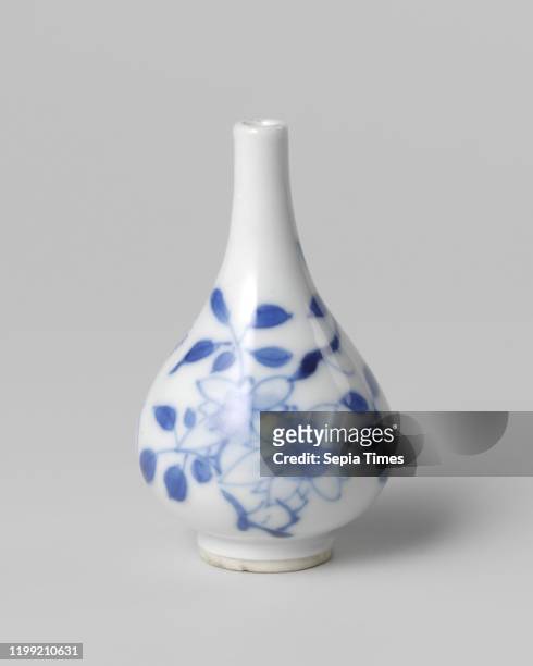 Miniature pear-shaped bottle vase with flowering plants, Miniature bottle-shaped porcelain vase with a pear-shaped body, painted in underglaze blue....