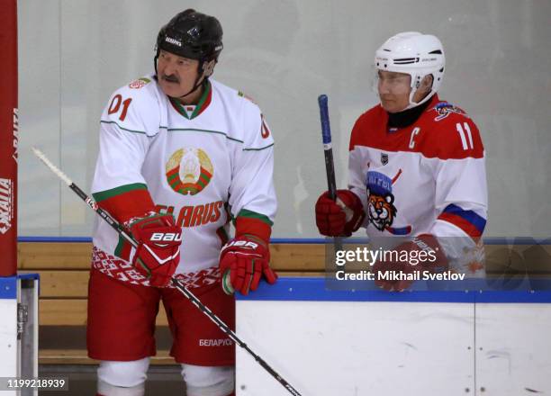 Russian President Vladimir Putin and Belarussian President Alexander Lukashenko attend an ice hockey match at Galaktika enternaoment center in Sochi,...