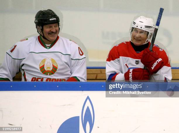 Russian President Vladimir Putin and Belarussian President Alexander Lukashenko attend an ice hockey match at Galaktika enternaoment center in Sochi,...