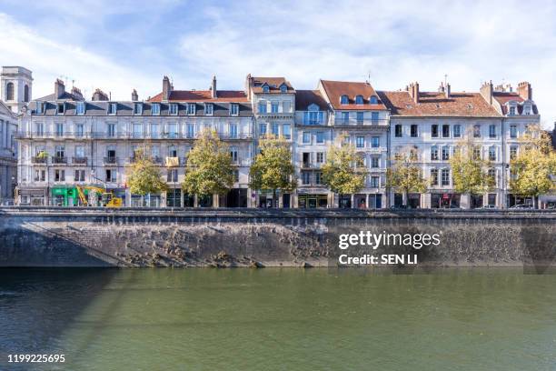 a traditional european town, urban landscape by the french town besancon canal - besancon photos et images de collection