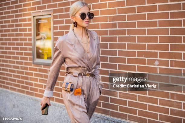 Caroline Caro Daur seen wearing mini Fendi bag, overall outside Fendi during Milan Fashion Week Fall/Winter 2020/2021 on January 13, 2020 in Milan,...