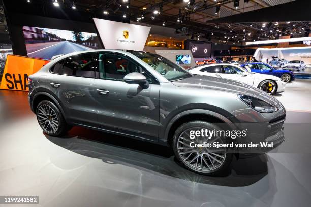 Porsche Cayenne Coupe luxury performance SUV on display at Brussels Expo on January 9, 2020 in Brussels, Belgium. The Cayenne Coupé is a sleeker...