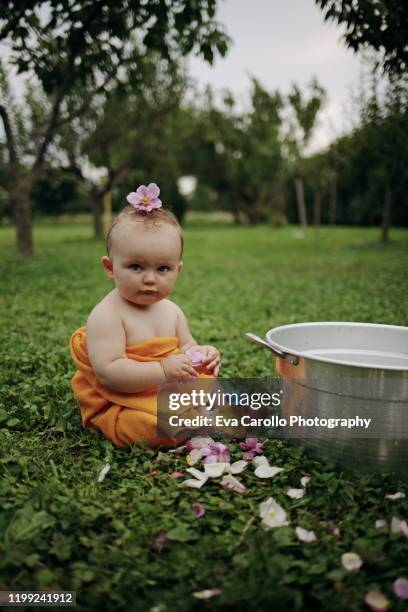 with a flower on my head - wash bowl fotografías e imágenes de stock