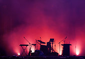 concert stage on rock festival, music instruments silhouettes