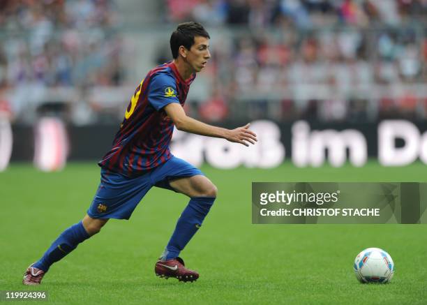 Barcelona's striker Juan Cuenca plays the ball during their Audi Cup football match FC Barcelona vs SC International de Porto Alegre in Munich,...