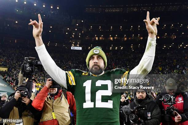 Aaron Rodgers of the Green Bay Packers celebrates after defeating the Seattle Seahawks 28-23 in the NFC Divisional Playoff game at Lambeau Field on...