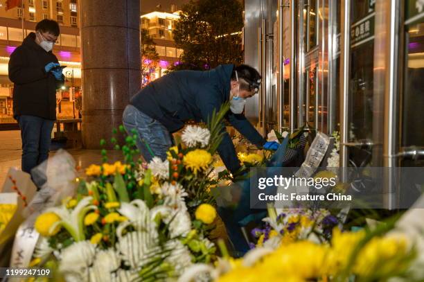 Citizen pays tribute to Dr. Li Wenliang at Li's hospital in Wuhan in central China's Hubei province Friday, Feb. 07, 2020. Li, regarded a...