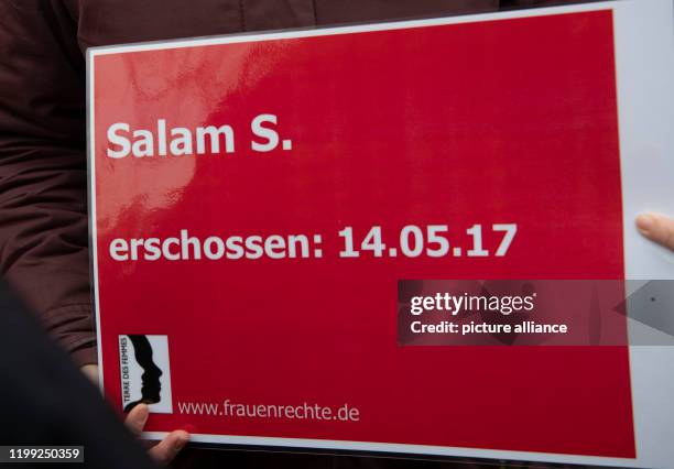 February 2020, Berlin: A sign with the inscription "Salam S. - shot: 15.05.17, www.frauenrechte.de" is held at the memorial place for Hatun Sürücü in...