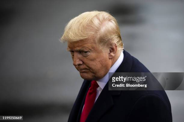President Donald Trump listens to a question while speaking to members of the media before boarding Marine One on the South Lawn of the White House...