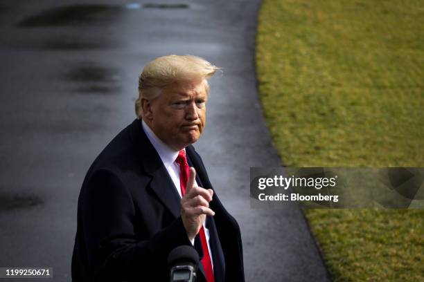 President Donald Trump pauses while speaking to members of the media before boarding Marine One on the South Lawn of the White House in Washington,...