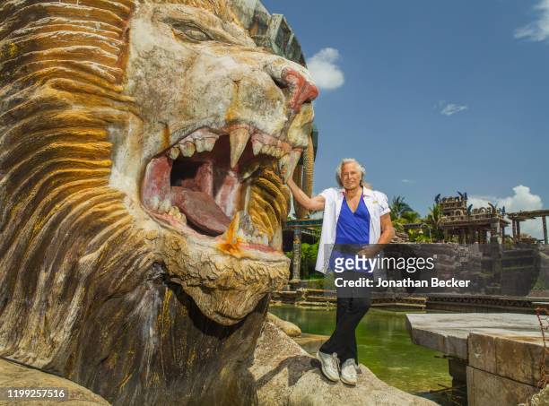 Billionaire Peter Nygard is photographed with one of his oversize lion heads for Vanity Fair Magazine on July 3, 2015 at Nygard Cay in Lyford Cay,...