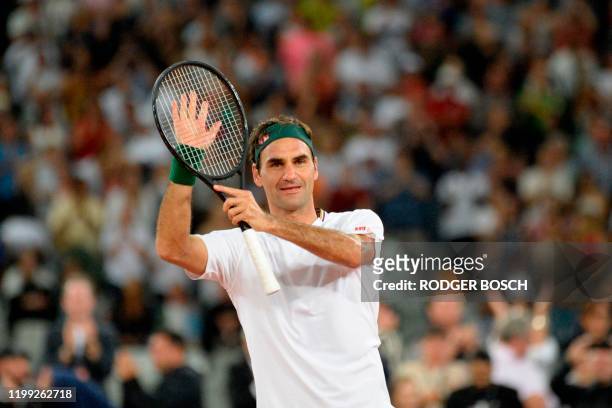 Switzerland's Roger Federer reacts after his victory against Spain's Rafael Nadal during their tennis match at The Match in Africa at the Cape Town...