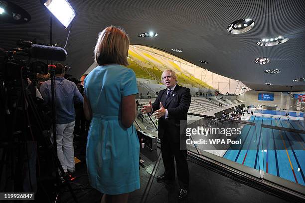 Mayor of London, Boris Johnson speaks during a television interview during the opening of the Aquatics Centre, venue for the London 2012 Olympic...