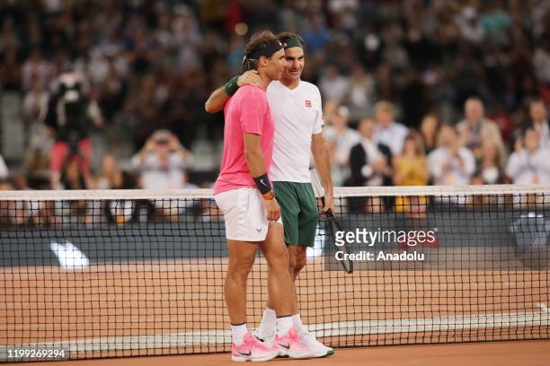 Roger Federer of Switzerland and Rafael Nadal of Spain play a tennis match at Cape Town Stadium as part of an exhibition game held to support the...