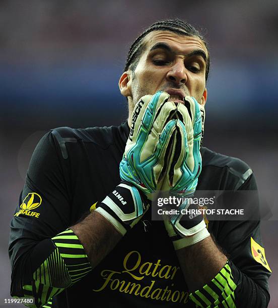 Barcelona's goalkeeper Jose Manuel Pinto grimaces during their Audi Cup football match FC Barcelona vs SC International de Porto Alegre in Munich,...