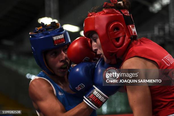 Omaylin Alcala from Venezuela fights Melanie Ubriaco from Uruguay during the future WBA Champions amateur boxing camp in Medellin, Colombia on...