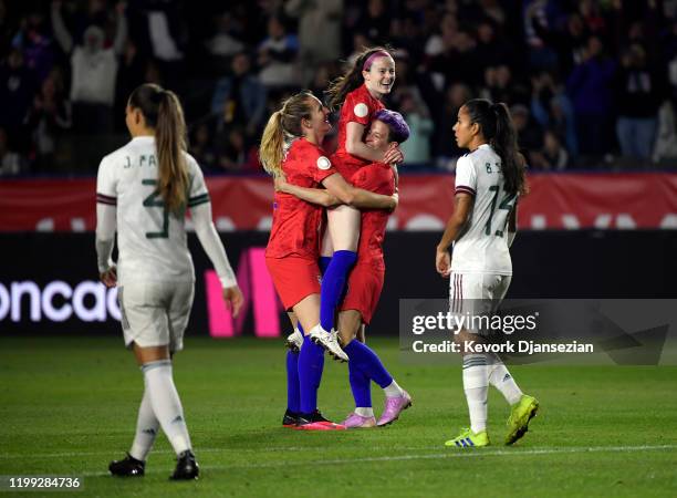 Megan Rapinoe and Sam Mewis of the United States celebrate Rose Lavelle's goal against Mexico during the first half of the Semifinals - 2020 CONCACAF...