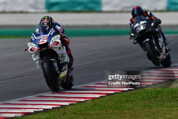 Johann Zarco of France and Reale Avintia Racing Team chasing by rider Red Bull KTM Tech 3 , Iker Lecuona during day two MotoGP Official Test Sepang...