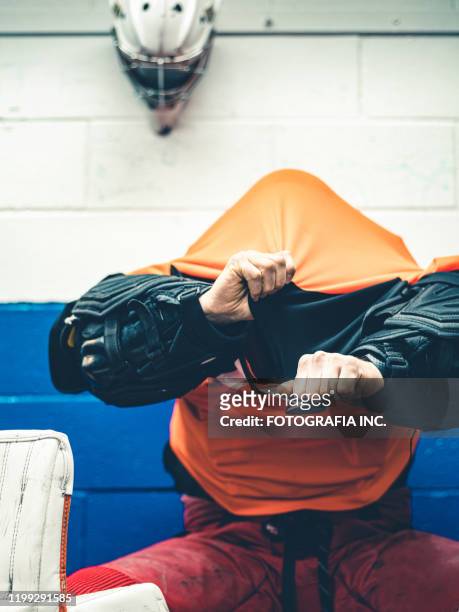 pro hockey goalie after the training - man wearing sports jersey stock pictures, royalty-free photos & images