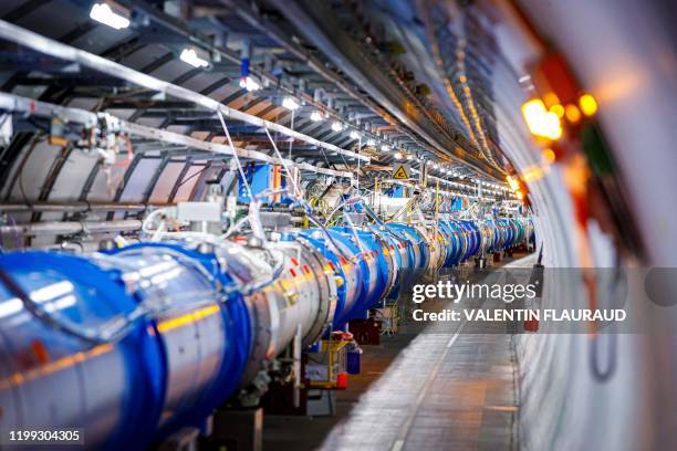 TOSome of the 1232 dipole magnets that bend the path of accelerated protons are pictured in the Large Hadron Collider in a tunnel of the European...