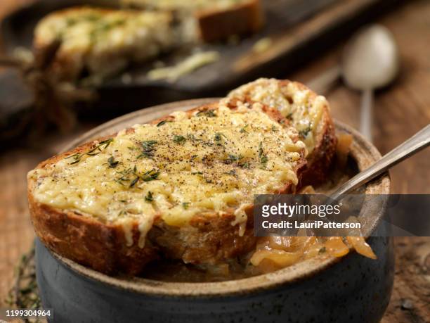 french onion soup with a herb gouda french bread - onion soup stock pictures, royalty-free photos & images