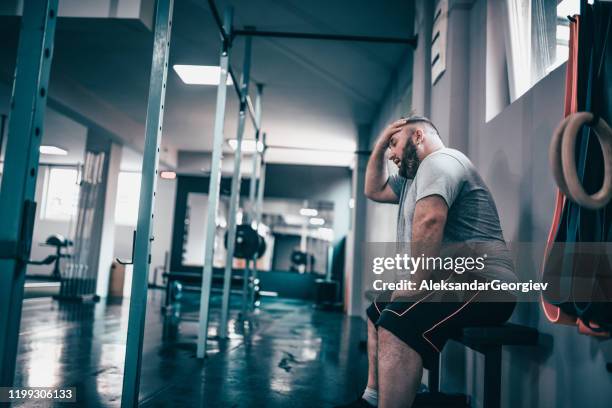 overweight male tired and relaxing after training - fat massage stock pictures, royalty-free photos & images