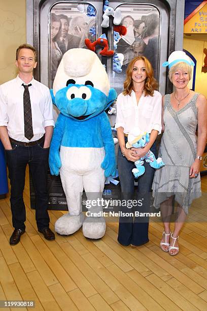 Actors Neil Patrick Harris, Jayma Mays and dughter of the smurfs creator Veronique Culliford visit the Build-A-Bear Workshop on July 27, 2011 in New...