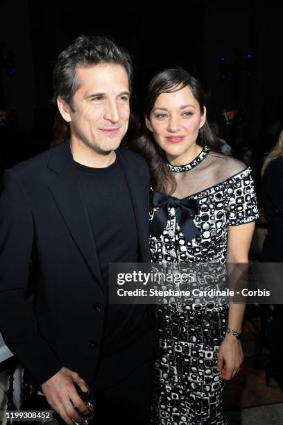 Guillaume Canet and Marion Cotillard attend the "Cesar - Revelations 2020" Photocall at Petit Palais on January 13, 2020 in Paris, France.
