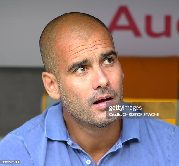 Barcelona's coach Josep Guardiola looks on ahead of the Audi Cup football match FC Barcelona vs SC International de Porto Alegre in Munich, southern...