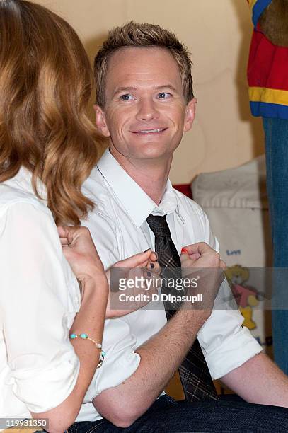 Actors Neil Patrick Harris and Jayma Mays visit the Build-A-Bear Workshop on July 27, 2011 in New York City.