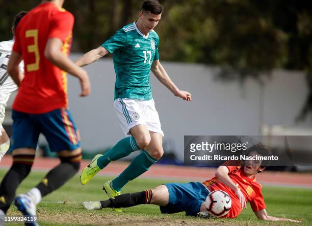 Igor Matanovic of Germany U17 battles for the ball with Adrian Corral Alciturri of Spain U17 on February 8, 2020 in Albufeira Portugal.