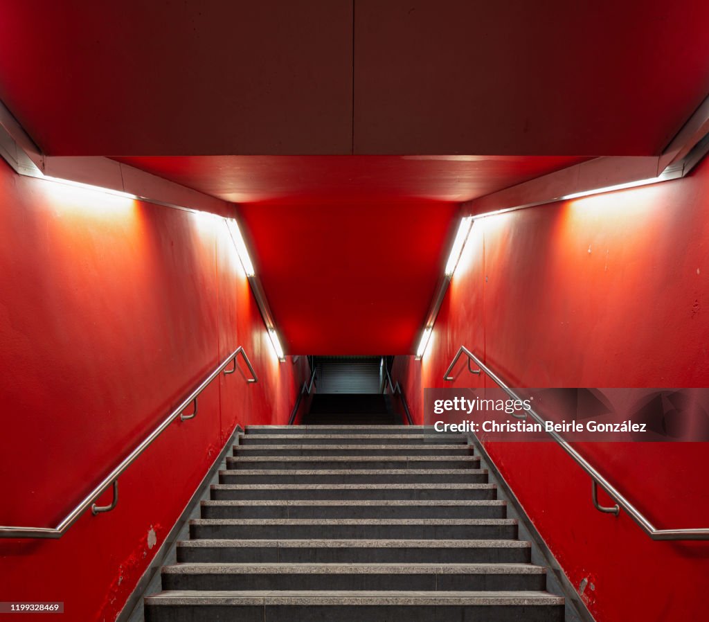 Red staircase of the exit of the S-Bahn station Trudering, Munich, Germany