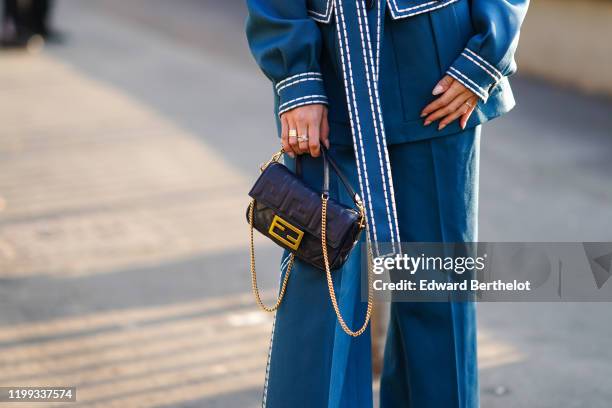 Fendi monogram bag is seen, outside Fendi, during Milan Fashion Week Menswear Fall/Winter 2020/2021, on January 13, 2020 in Milan, Italy.