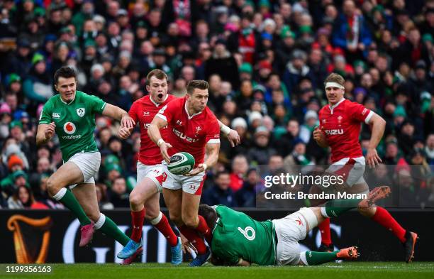 Dublin , Ireland - 8 February 2020; Dan Biggar of Wales is tackled by Peter O'Mahony of Ireland during the Guinness Six Nations Rugby Championship...