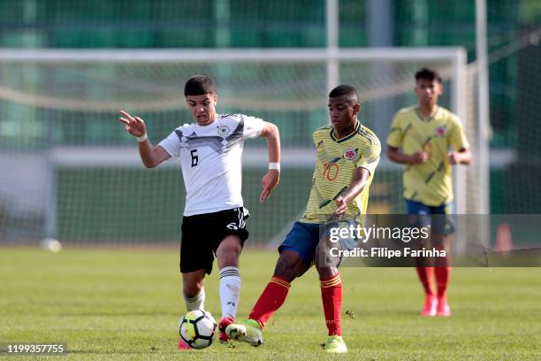 Eyup Aydin of Germany battles for the ball with Jhon Solis of Colombia during the U16 UEFA development tournament game between Germany U16 and...