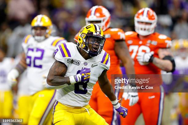 Patrick Queen of the LSU Tigers celebrates a huge defensive stop against Clemson Tigers in the College Football Playoff National Championship game at...