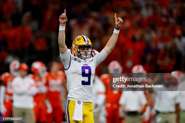 Joe Burrow of the LSU Tigers reacts to a touchdown against Clemson Tigers during the third quarter in the College Football Playoff National...