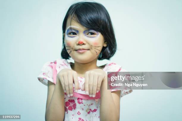 girl with painted face - animal imitation stock pictures, royalty-free photos & images