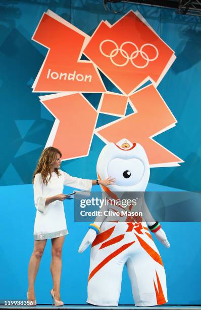 Host Ellie Crisell introduces Wenlock, London 2012 Olympic Game mascot during the' London 2012 - One Year To Go' ceremony in Trafalgar Square on July...