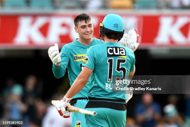 Matthew Renshaw and Joe Burns of the Heat celebrate victory after winning the Big Bash League match between the Brisbane Heat and the Adelaide...