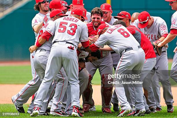 Starting pitcher Ervin Santana of the Los Angeles Angels is mobbed by his teammates in celebration after Santana finishing a no-hitter against the...