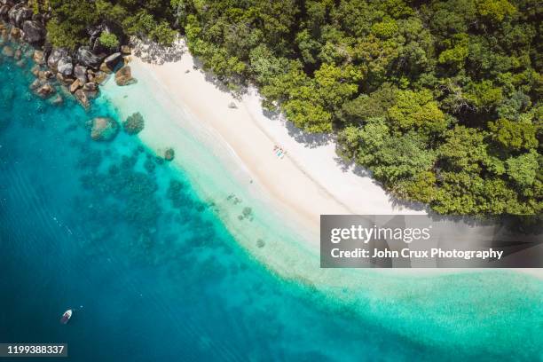 nudey beach sunbathers - cairns stock-fotos und bilder
