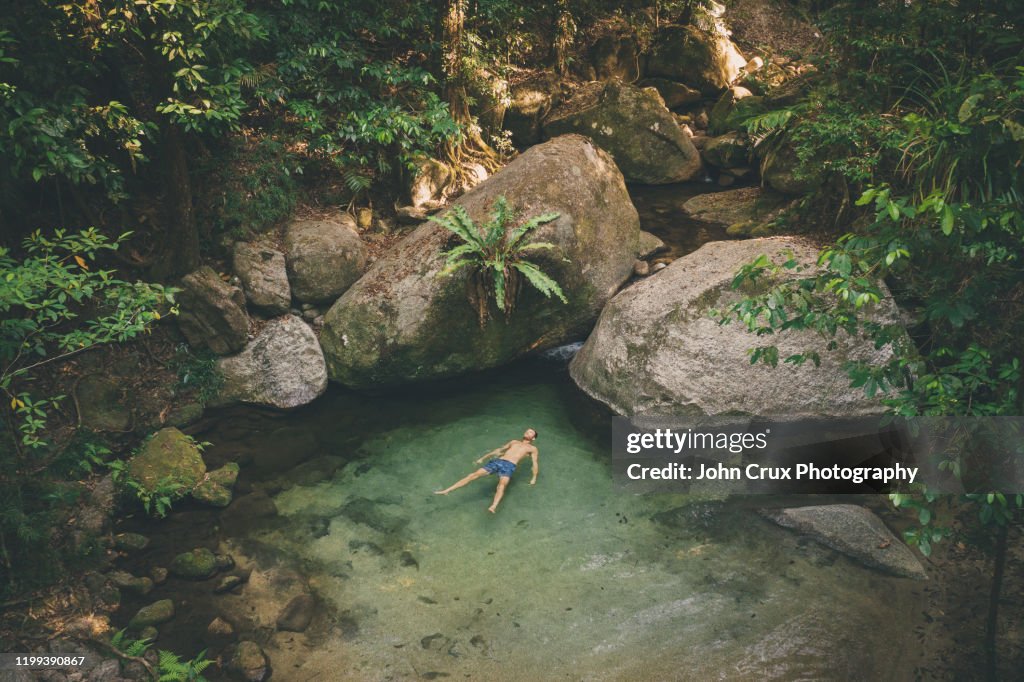 Mossman gorge swimming tourist