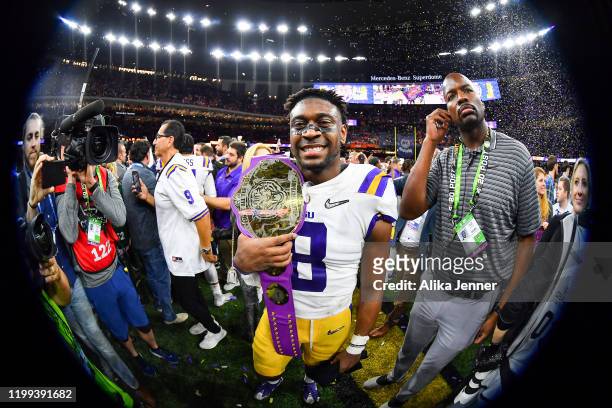 Patrick Queen of the LSU Tigers is all smiles after the College Football Playoff National Championship game against the Clemson Tigers at the...