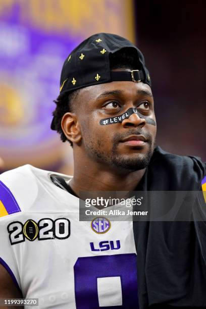 Patrick Queen of the LSU Tigers looks on as he stands on the championship stage after the College Football Playoff National Championship game against...