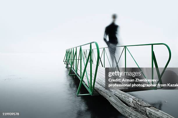 man walking on wharf - isolated colour stockfoto's en -beelden