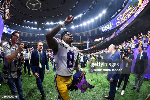 Patrick Queen of the LSU Tigers waves to fans after the College Football Playoff National Championship game against the Clemson Tigers at the...